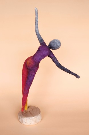 Joy - a lithe, elegant needlefelt art doll in flame colours. She is a dancer, reaching out with an upward gaze