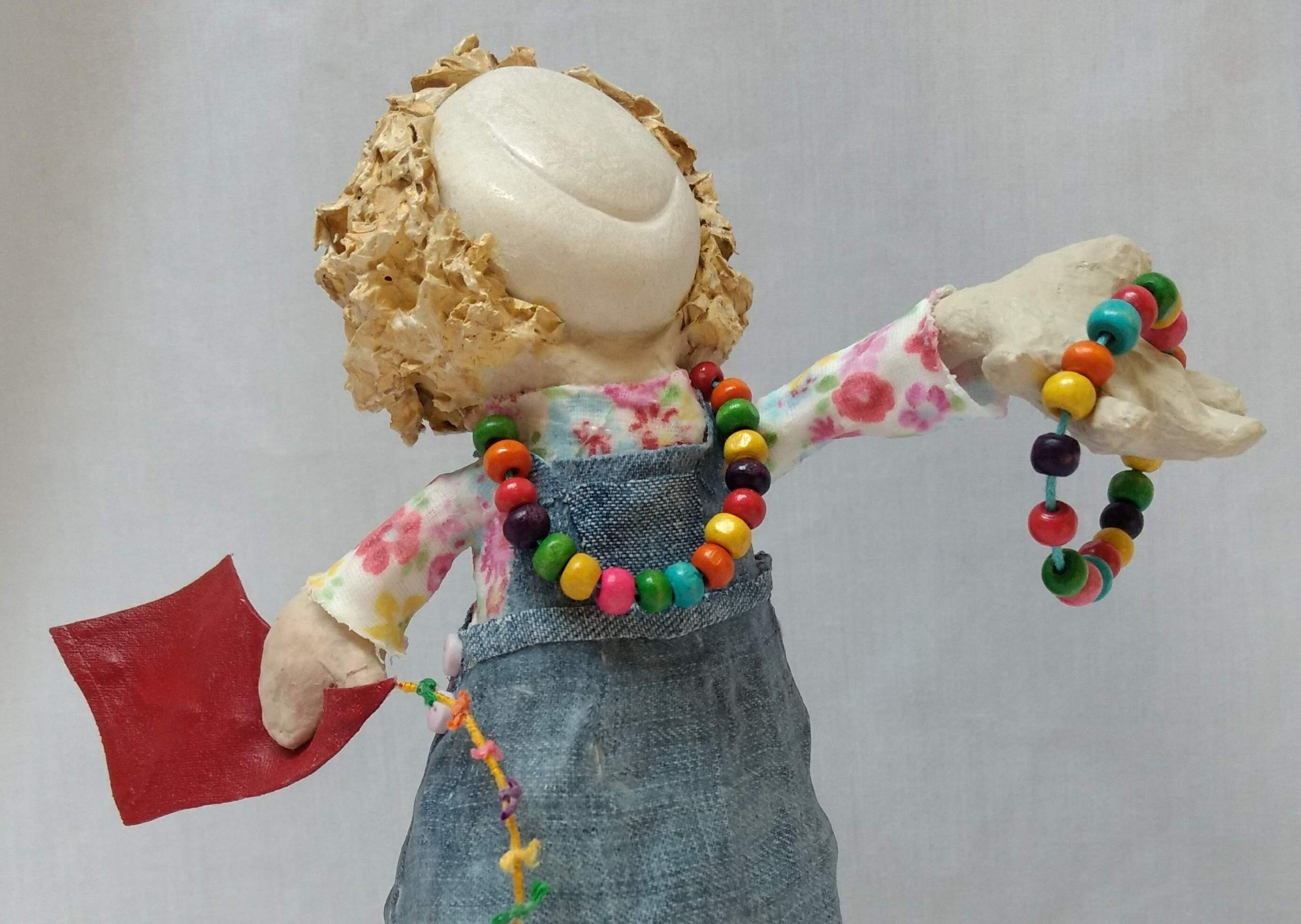 papier mache art doll. a child invites you to play!